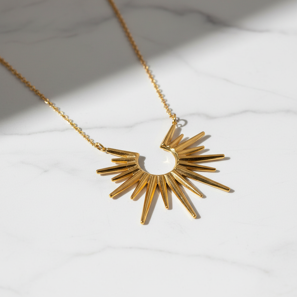 Gold Sunburst Statement Necklace on clean minimal surface